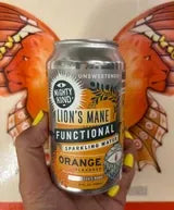 Mighty Kind Lion's Mane sparkling water in hand